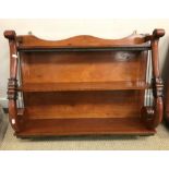 A pair of 20th Century mahogany hanging wall shelves in the William IV manner,