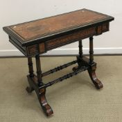 A late Victorian ebonised and amboyna veneered fold over card table in the aesthetic taste,