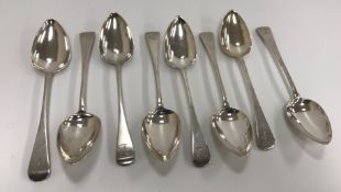 A set of eight Georgian silver "Old English" pattern dessert spoons,