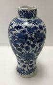 A 19th Century Chinese blue and white baluster shaped vase decorated with four toed dragons