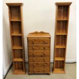A modern pine chest of six drawers on turned feet,