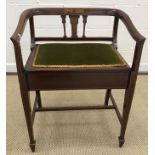 An Edwardian mahogany and inlaid box seat dressing stool with arms on square tapered legs united by