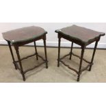 A pair of 20th Century figured walnut and cross banded shaped rectangular top occasional tables on