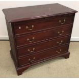 A modern mahogany chest of four long drawers in the Georgian style raised on bracket feet 99 cm