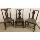 Four various stick back chairs each with pierced centre splats, one with wheel, one with star,