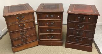 Three reproduction mahogany two drawer filing cabinets as Georgian chests of four drawers,