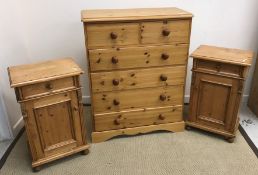 A modern pine chest of two short over four long graduated drawers with turned knob handles,