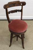 A Victorian stained beech simulated rosewood bar back music chair,