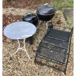 A collection of garden wares comprising two Weber barbecues, a fire pit,