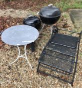 A collection of garden wares comprising two Weber barbecues, a fire pit,