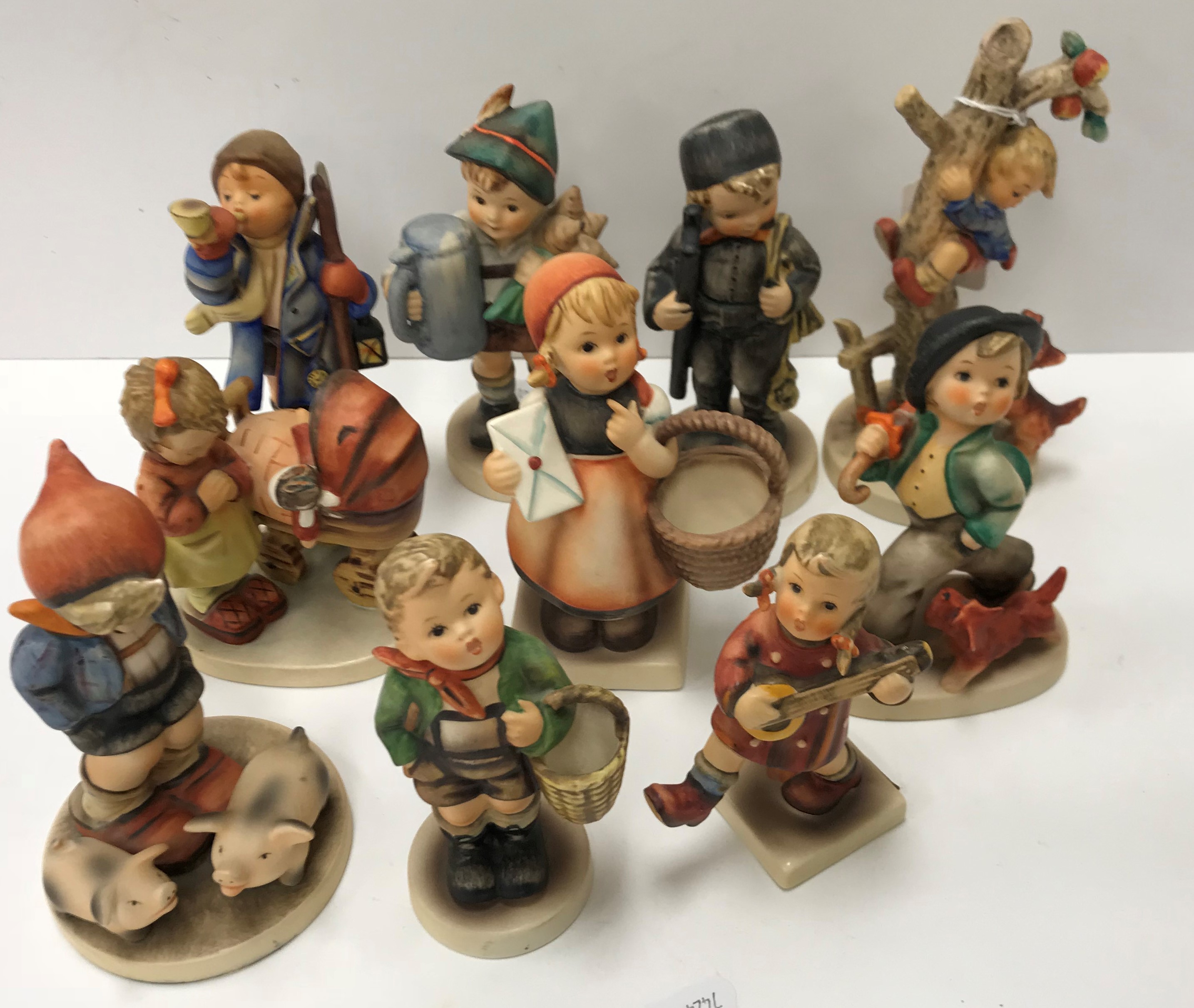 A collection of twenty Goebal Hummel figures including 
