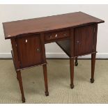 A modern mahogany and cross banded serpentine fronted sideboard in the Georgian style with central