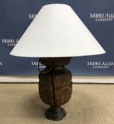 A 19th Century Sicilian carved walnut table lamp in the 17th Century style decorated with panels of