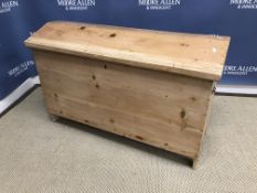 A Continental pine trunk or coffer with shaped lid and carrying handles,
