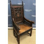 A Victorian Gothic Revival carved oak throne chair in the manner of Pugin,