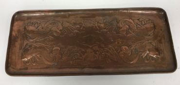 Two circa 1900 Newlyn copper rectangular trays, both with fish motifs and stamped "Newlyn",