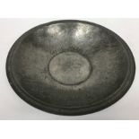 An Arts & Crafts pewter bowl with chevron decoration to the rim and centre inscribed "RW Ltd" to
