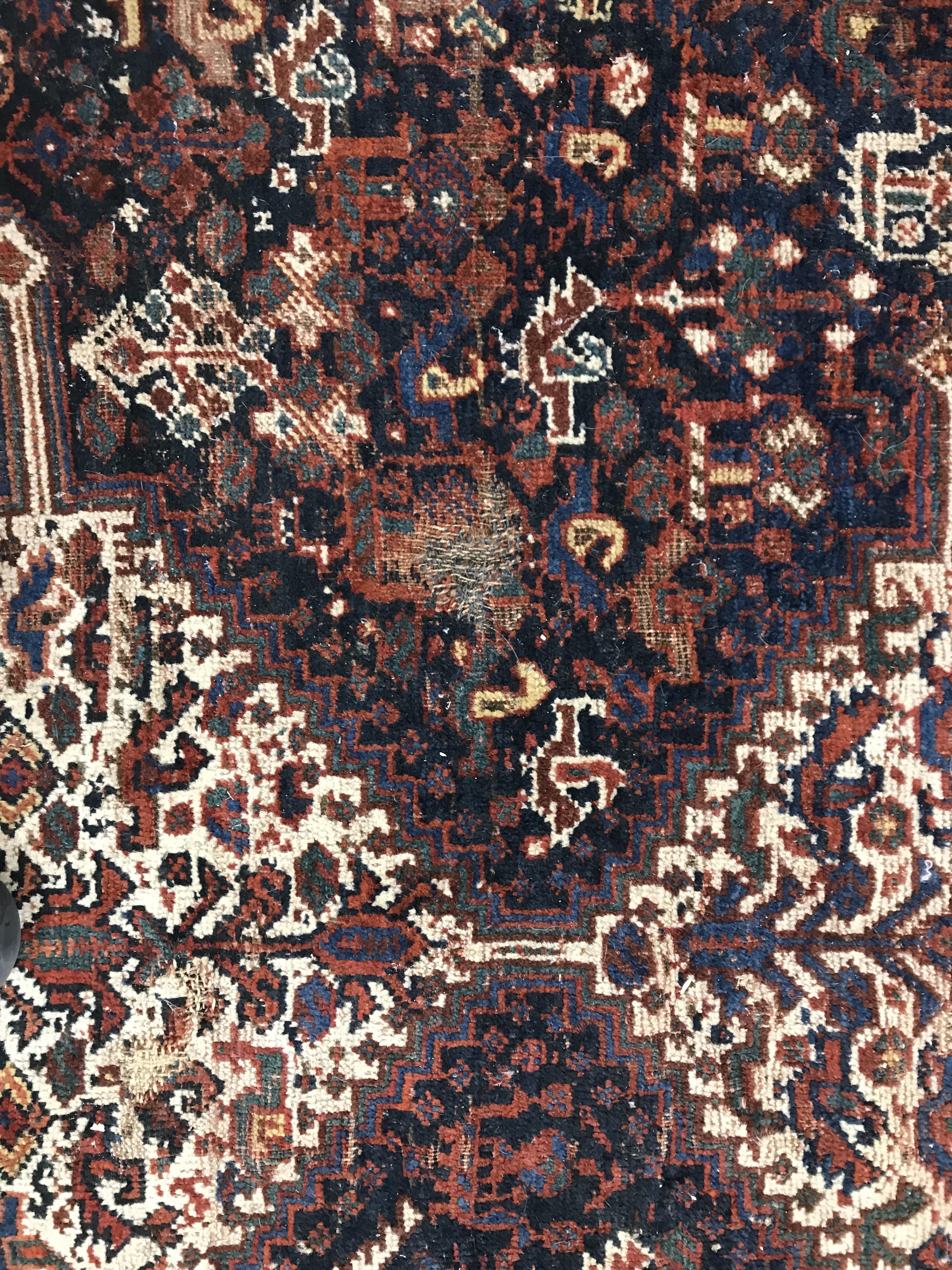 A Persian carpet, the central panel set with repeating medallions on a dark blue ground, - Image 29 of 93