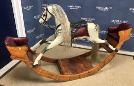 A late Victorian G J Lines 'Caledonia' dapple-painted rocking horse cum see-saw with leather saddle