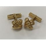 A modern pair of 18 carat gold cufflinks of cross knot form by Tiffany & Co, total weight 14.