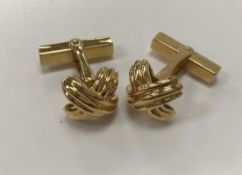 A modern pair of 18 carat gold cufflinks of cross knot form by Tiffany & Co, total weight 14.