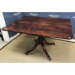 An early 19th Century mahogany tea table,