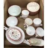 A 19th Century china part tea set with oxide red decoration