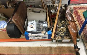 A collection of items to include a vintage yoke, various horse brasses on leather mounts,