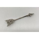 An early 20th Century 15 carat gold and platinum rose cut diamond set jabot pin of arrow form