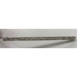 An early 20th Century white metal mounted old cut diamond set bar brooch with 27 stones approximate