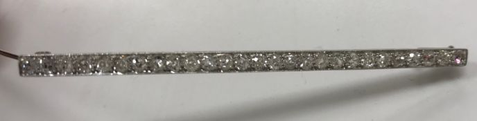 An early 20th Century white metal mounted old cut diamond set bar brooch with 27 stones approximate