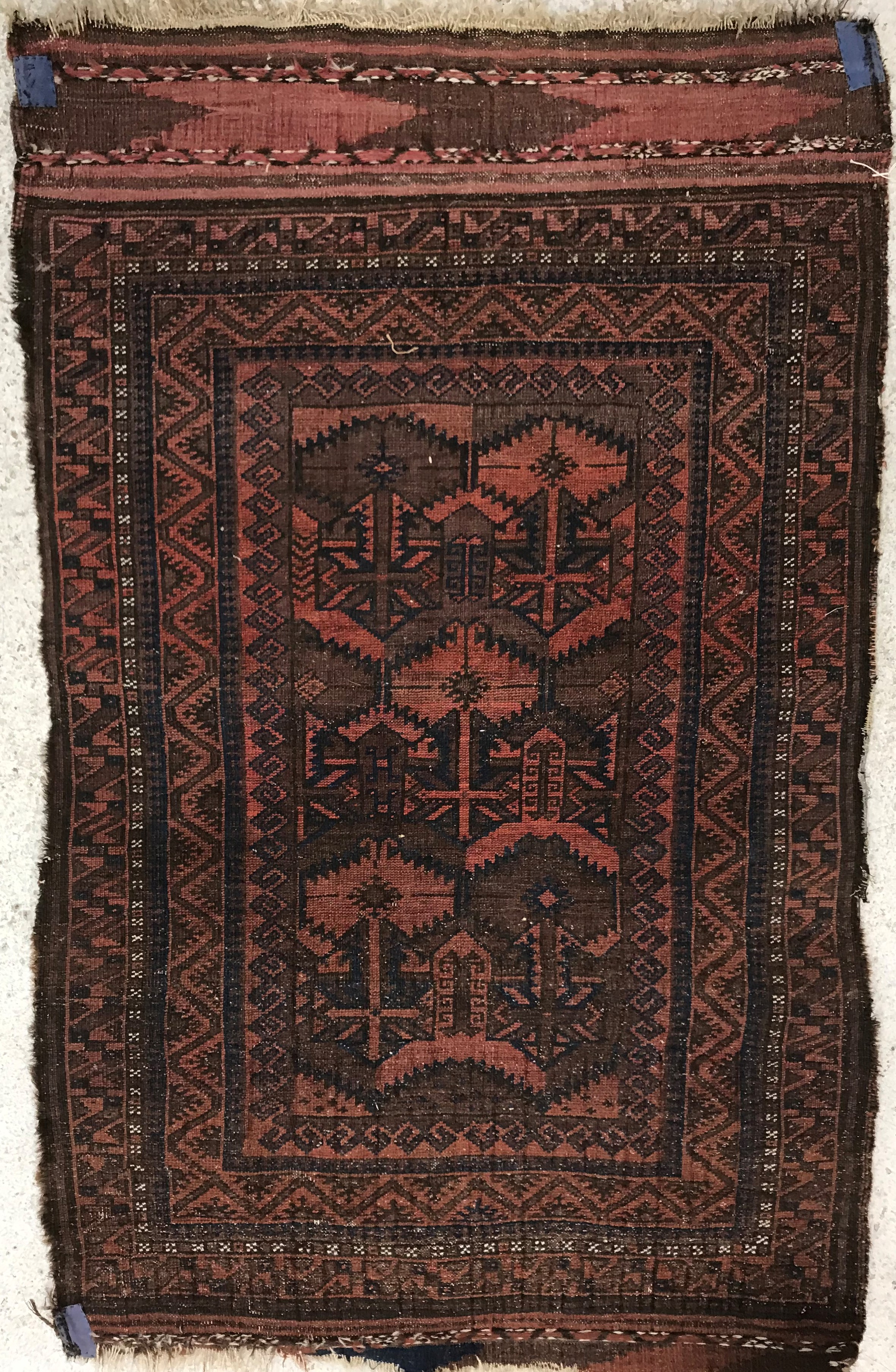 A Belouch rug, the central panel set with geometric design on a red ground, - Image 2 of 2