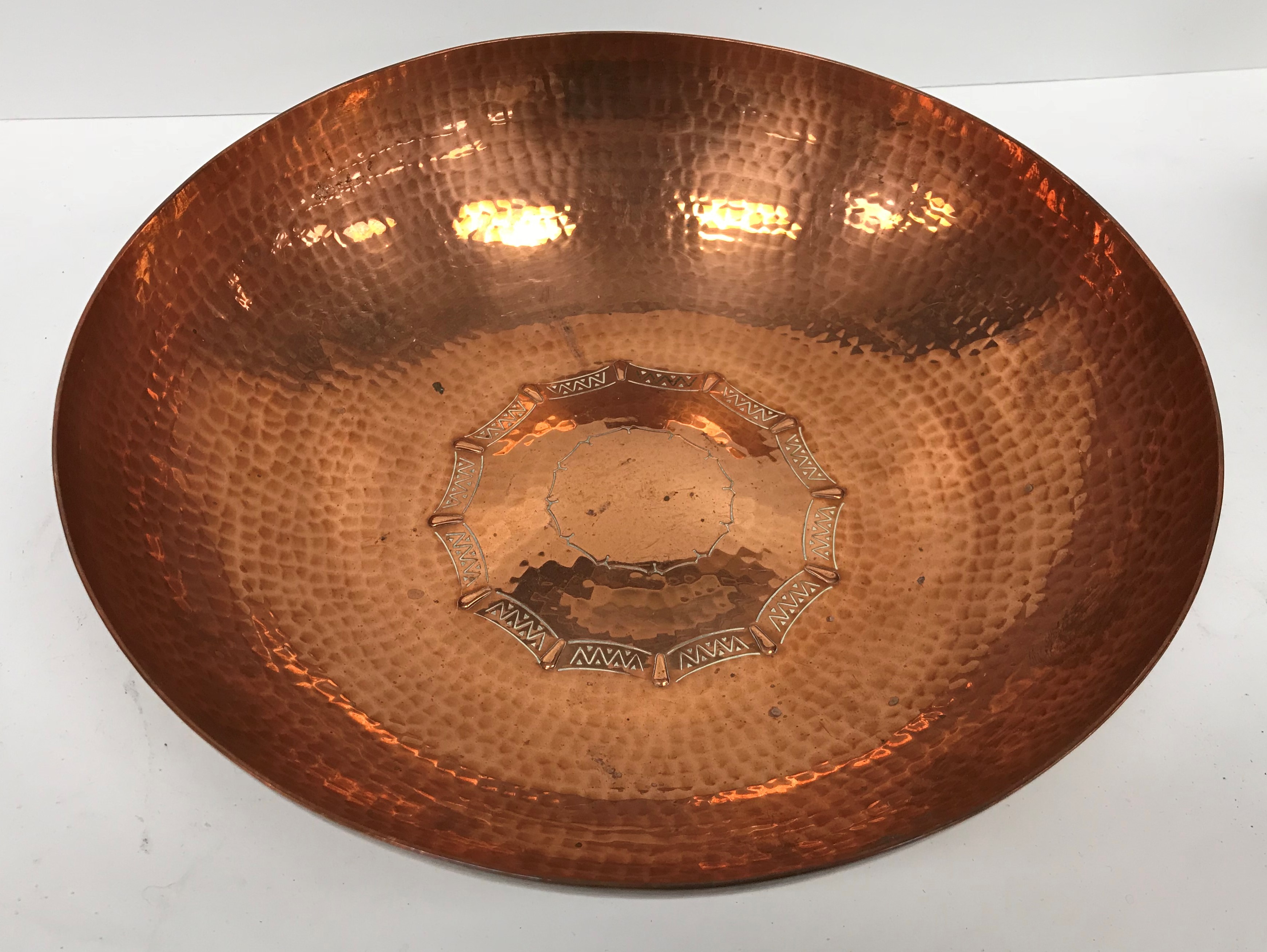 A copper bowl with hammered decoration, inscribed "LRI Borrowdale" hand-beaten to base, - Image 2 of 5