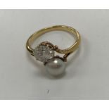 WITHDRAWN An early 20th Century 22 carat gold old European cut diamond and bouton pearl set ring,