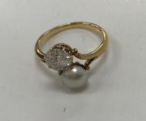 WITHDRAWN An early 20th Century 22 carat gold old European cut diamond and bouton pearl set ring,