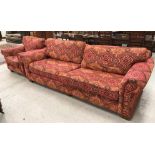 A large modern upholstered sofa in Bokhara style fabric, raised on block feet,