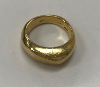 An 18 carat gold ring with tapered top 14.