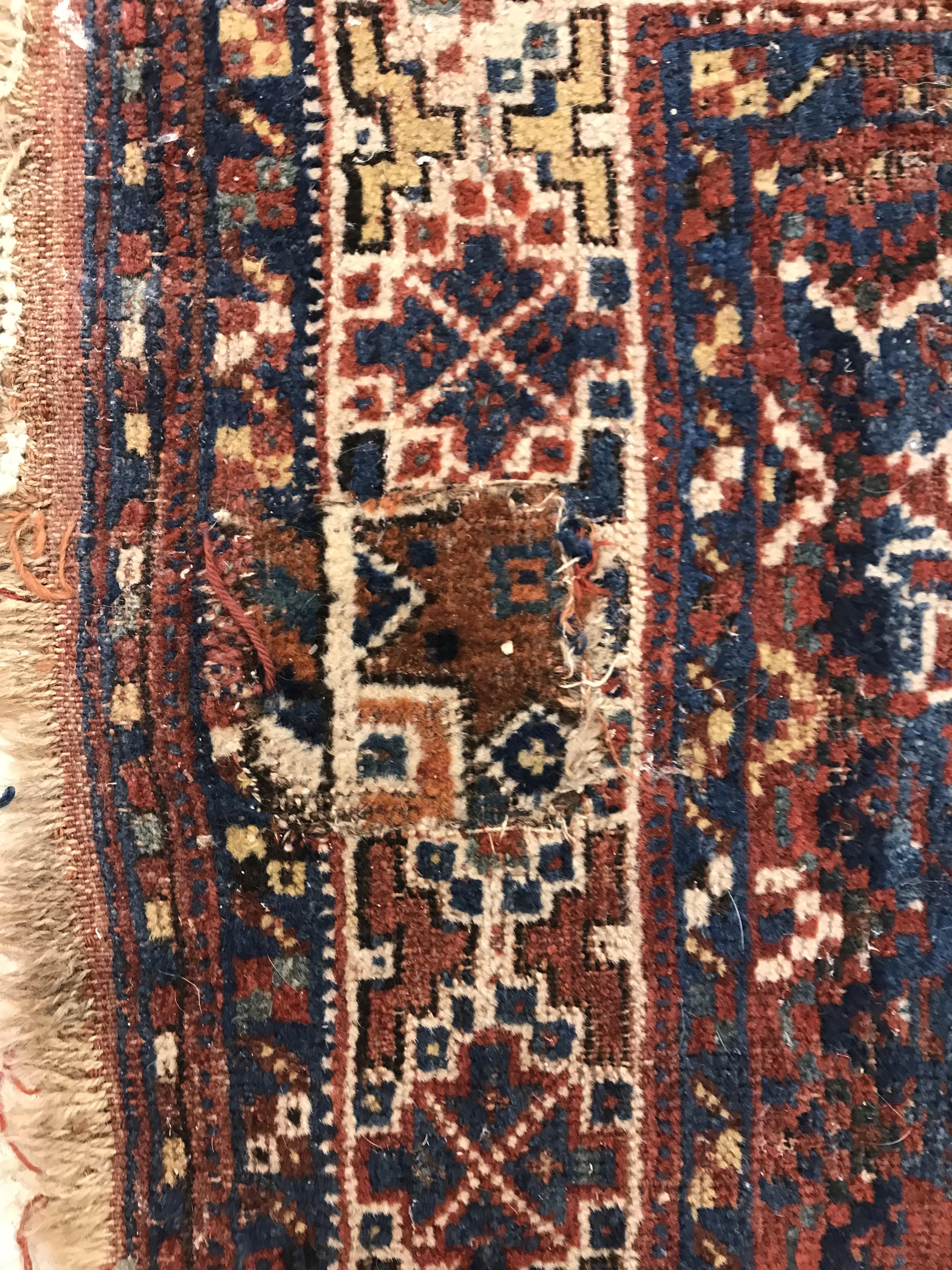 A Persian carpet, the central panel set with repeating medallions on a dark blue ground, - Image 10 of 93