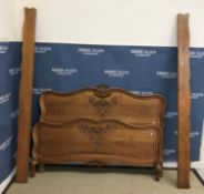 A 20th Century French oak bedstead in the Louis XV provincial manner,