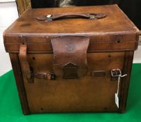 A square leather hat box/vanity case,