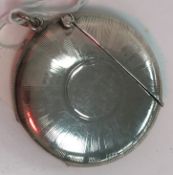 An Edwardian silver Vesta case of circular form with sunburst engraved decoration (by Horace