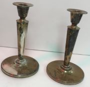 A pair of mid 20th Century silver Swedish candlesticks of plain form, raised on circular foot base,