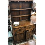 An oak dresser in the Old Charm manner,
