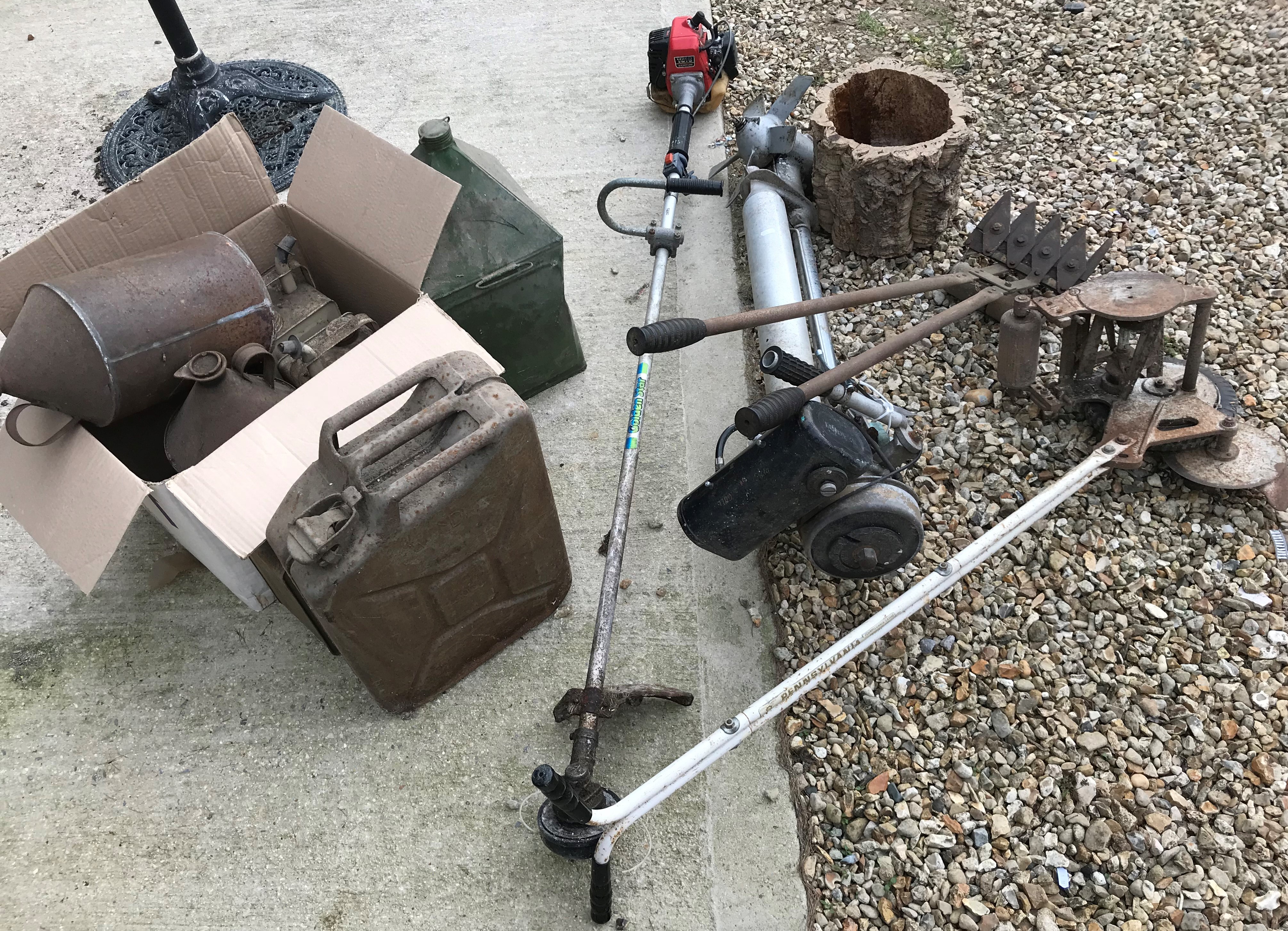 A collection of items to include a Seagull outboard motor, a petrol driven strimmer,