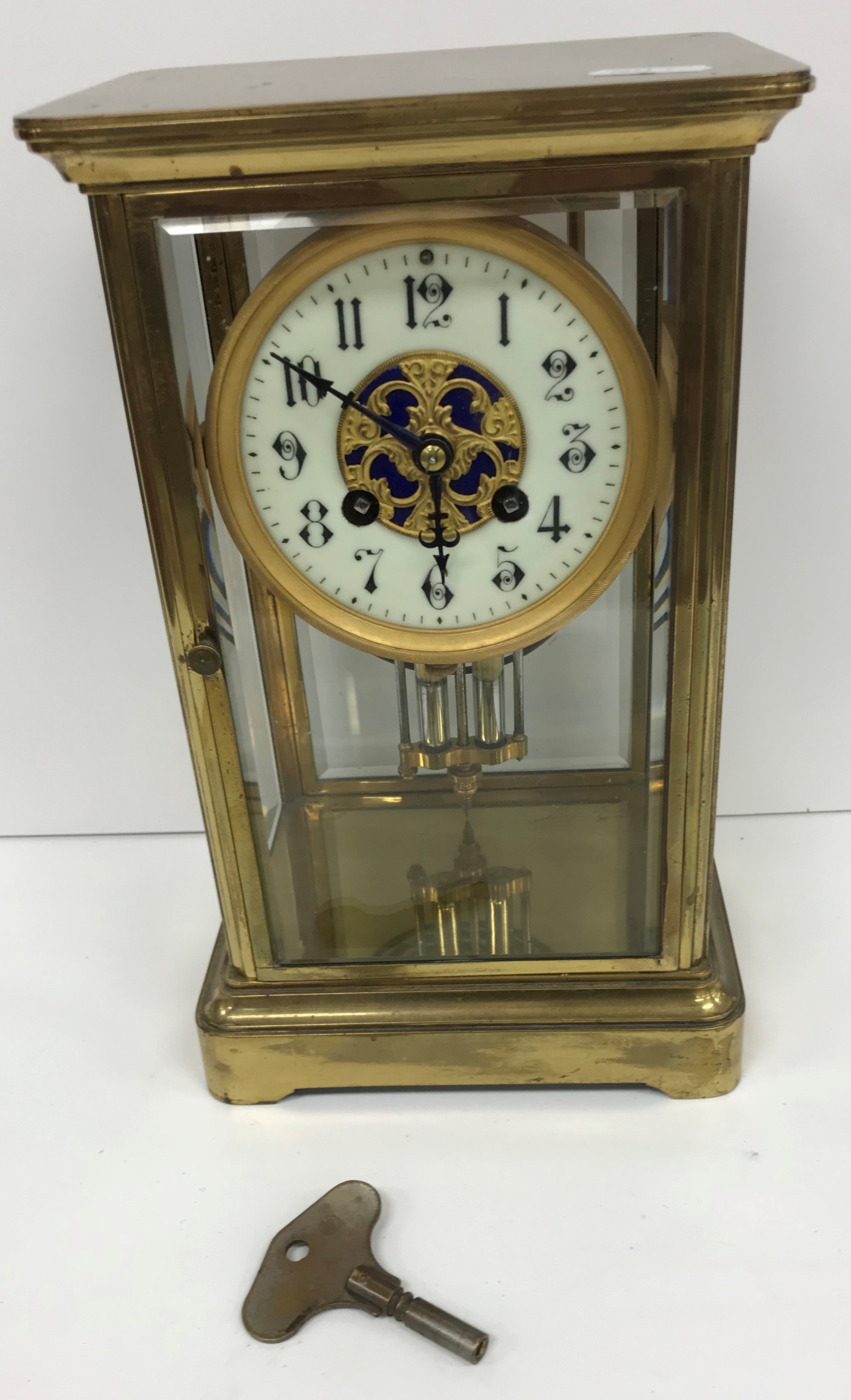 A circa 1900 French four glass brass cased mantel clock in the manner of Marti,
