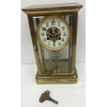 A circa 1900 French four glass brass cased mantel clock in the manner of Marti,