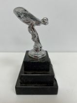A modern chrome plated figure of the Spirit of Ecstasy on a stepped black stone base 12.