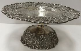 A sterling silver pierced rim tazza with C scroll decoration and engraved scrolling decoration to