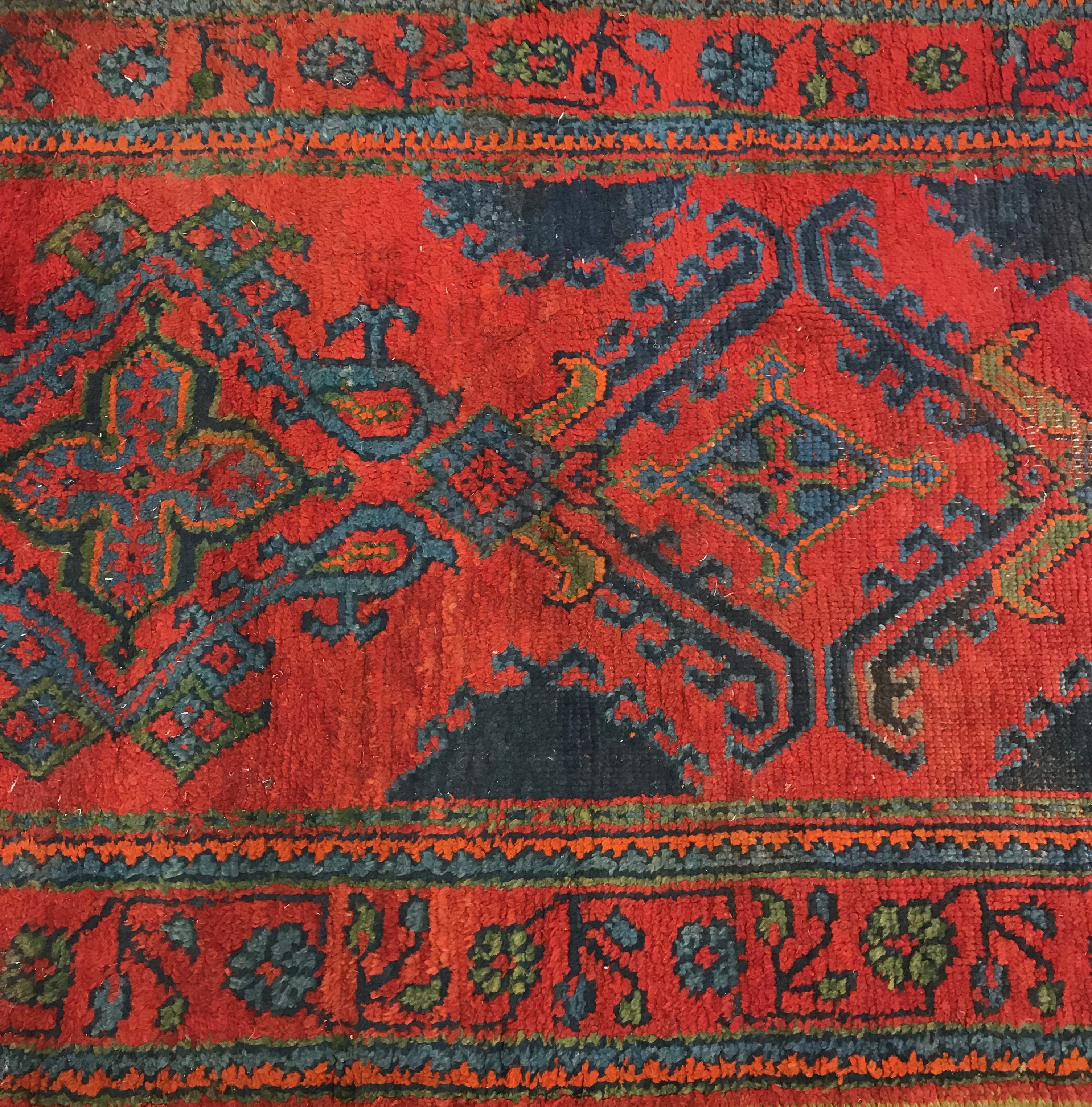 A Donegal style runner, the central panel set with repeating geometric designs on a red ground, - Image 3 of 7
