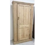 A Victorian pine single door cupboard of slim proportions,